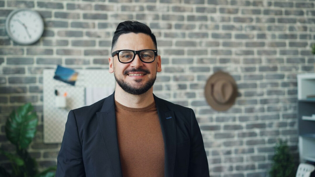 successful young entrepreneur smiling